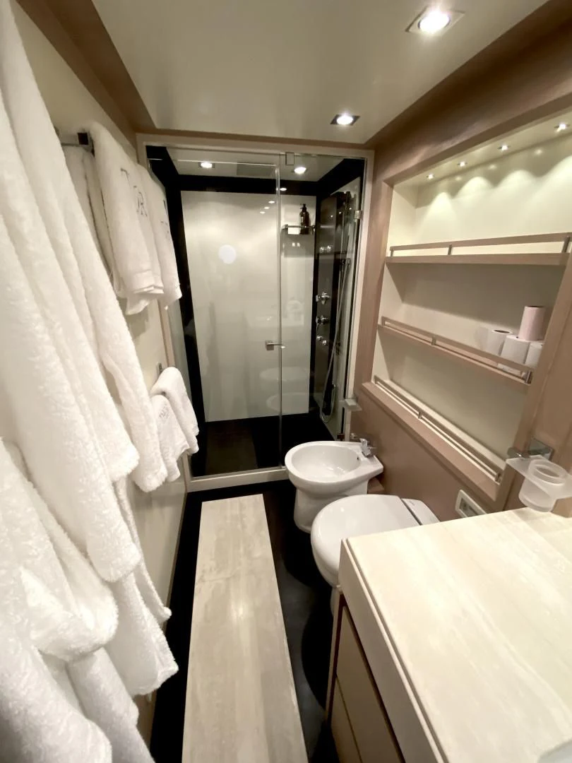 a bathroom with a toilet and a sink aboard THOR Yacht for Sale