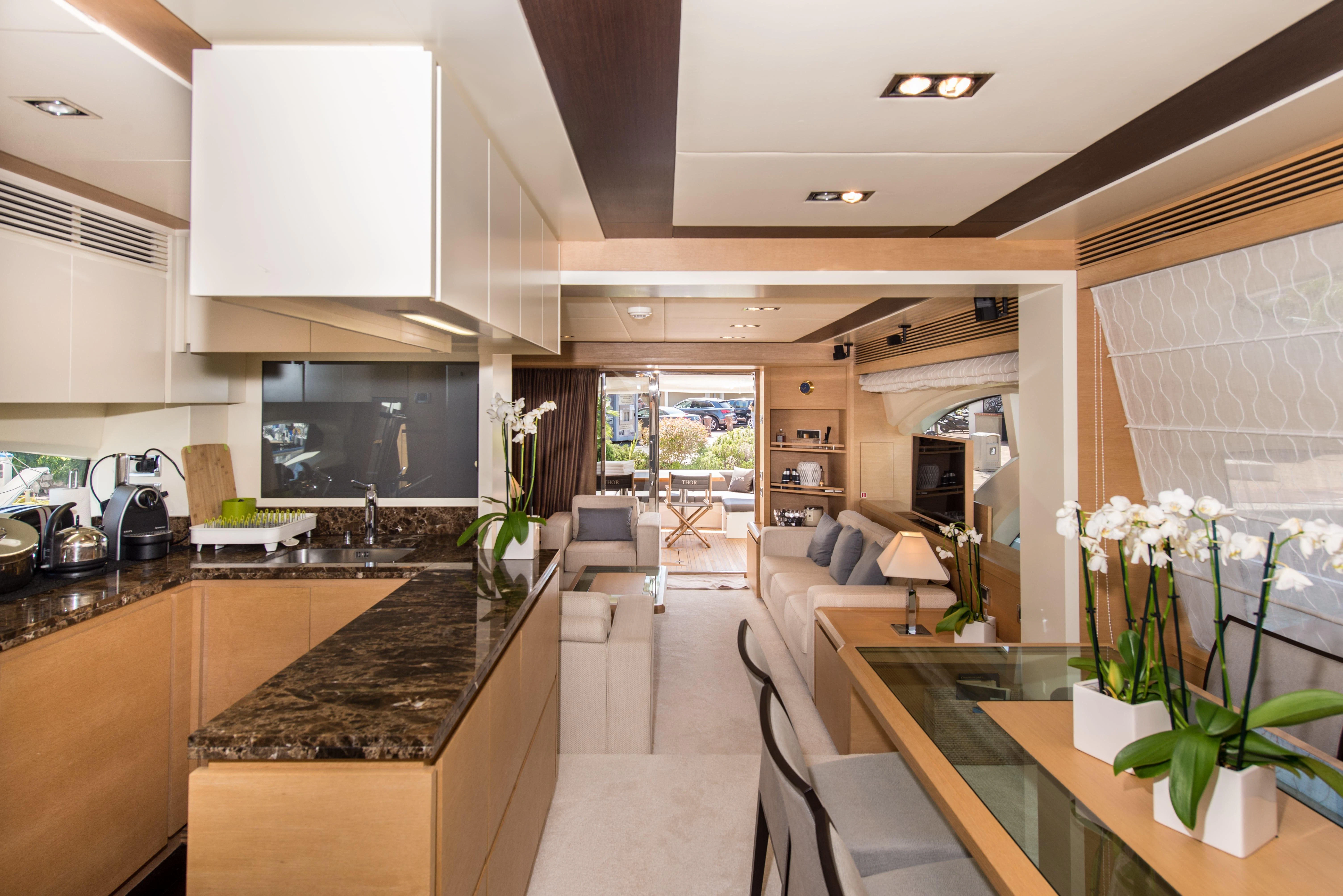 a kitchen with a large island aboard THOR Yacht for Sale