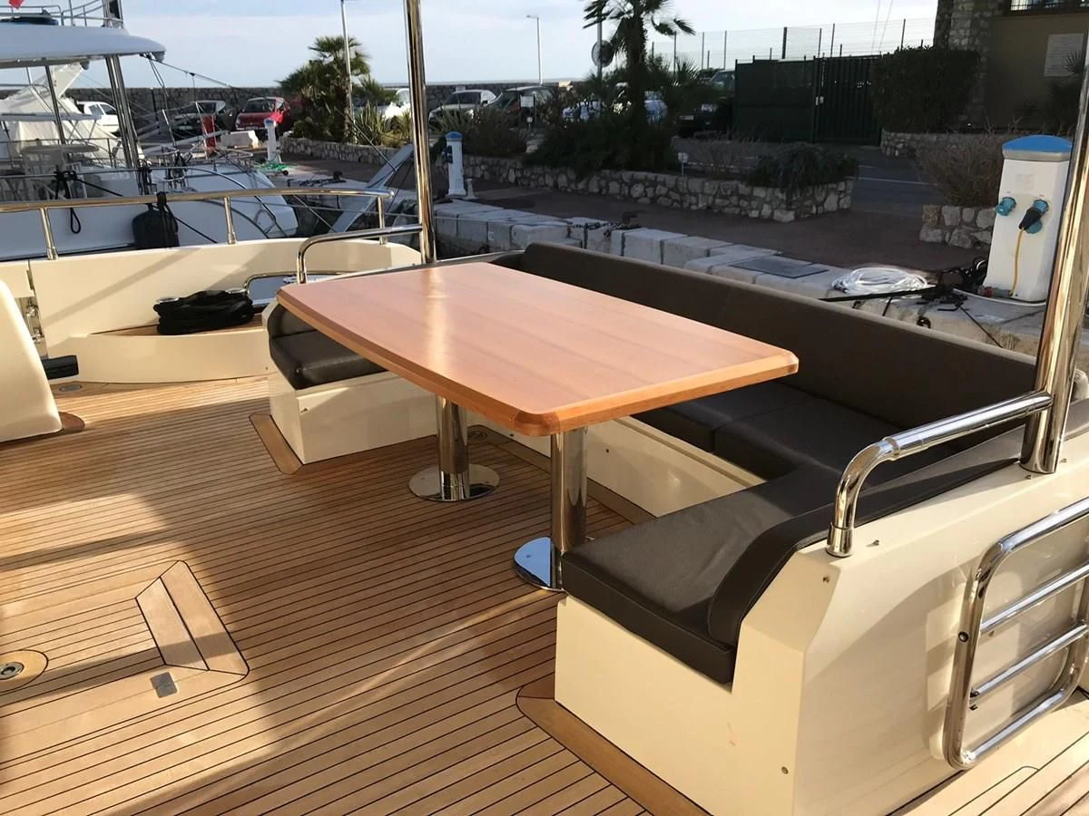 a table on a deck aboard THOR Yacht for Sale