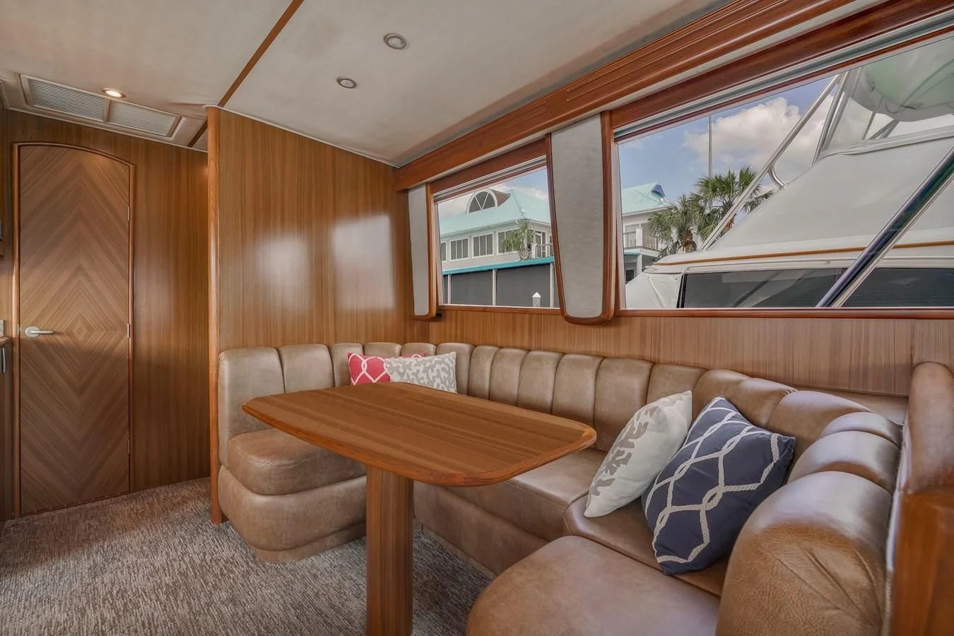 a living room with a couch and a table aboard RHINO FISH Yacht for Sale