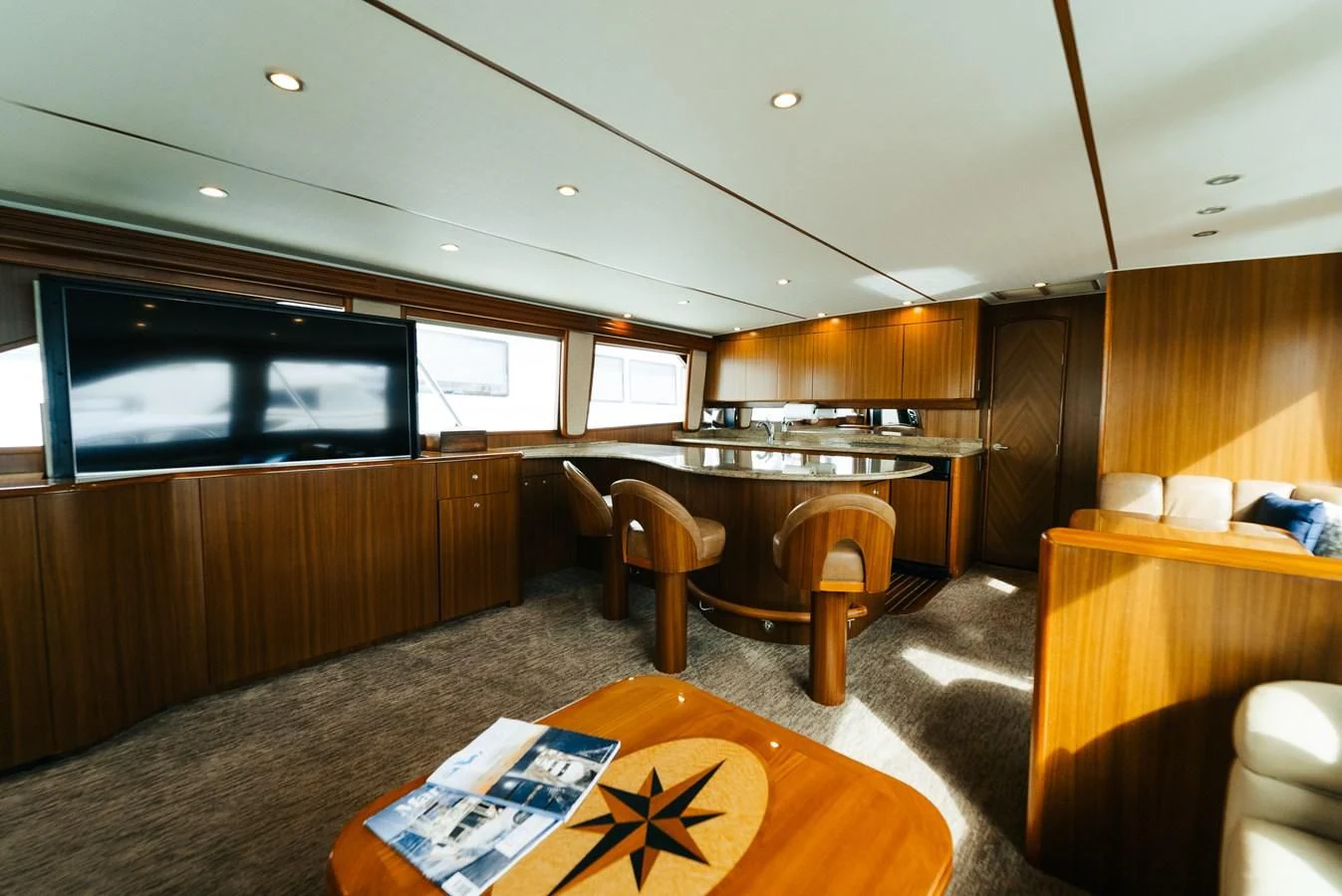 a room with a table and chairs aboard RHINO FISH Yacht for Sale