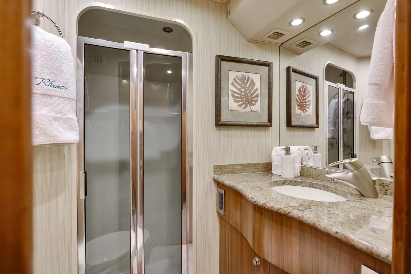 a bathroom with a glass shower aboard RHINO FISH Yacht for Sale