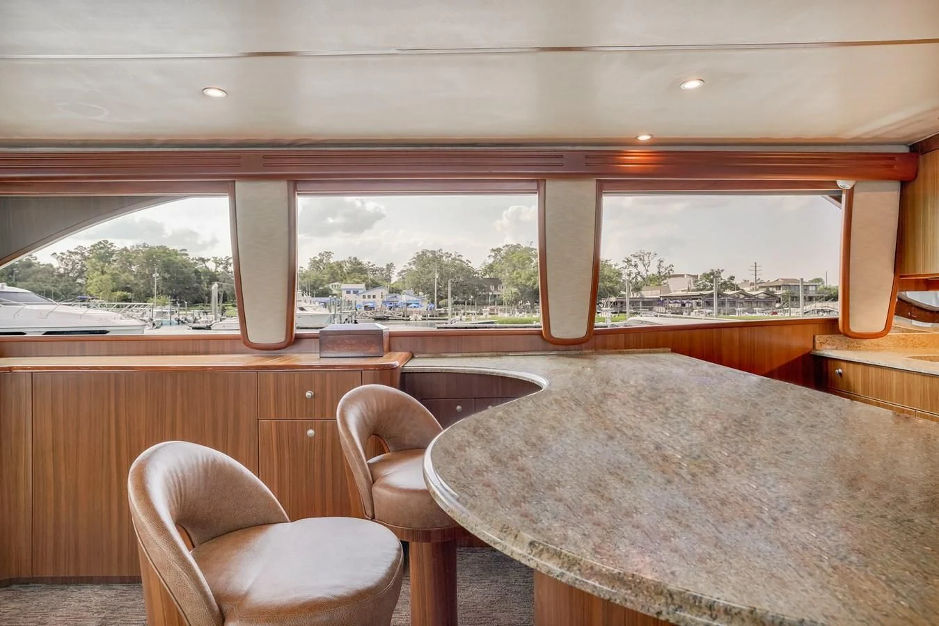 a table and chairs in a room aboard RHINO FISH Yacht for Sale