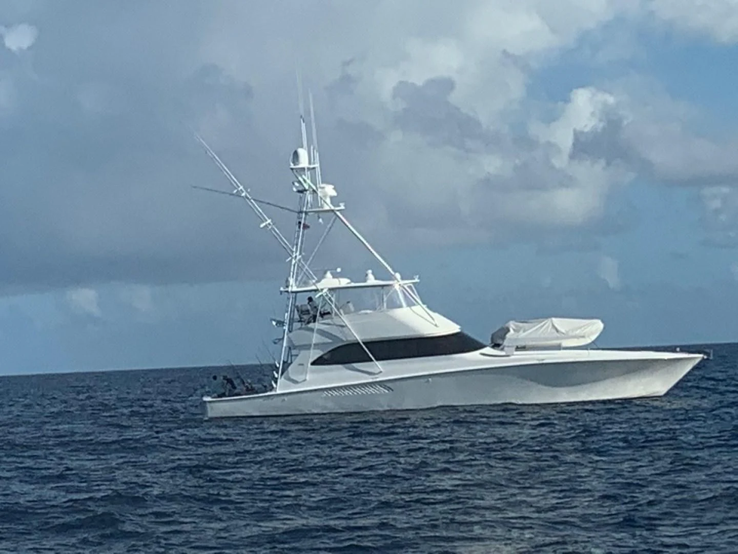 a white boat in the water aboard RHINO FISH Yacht for Sale