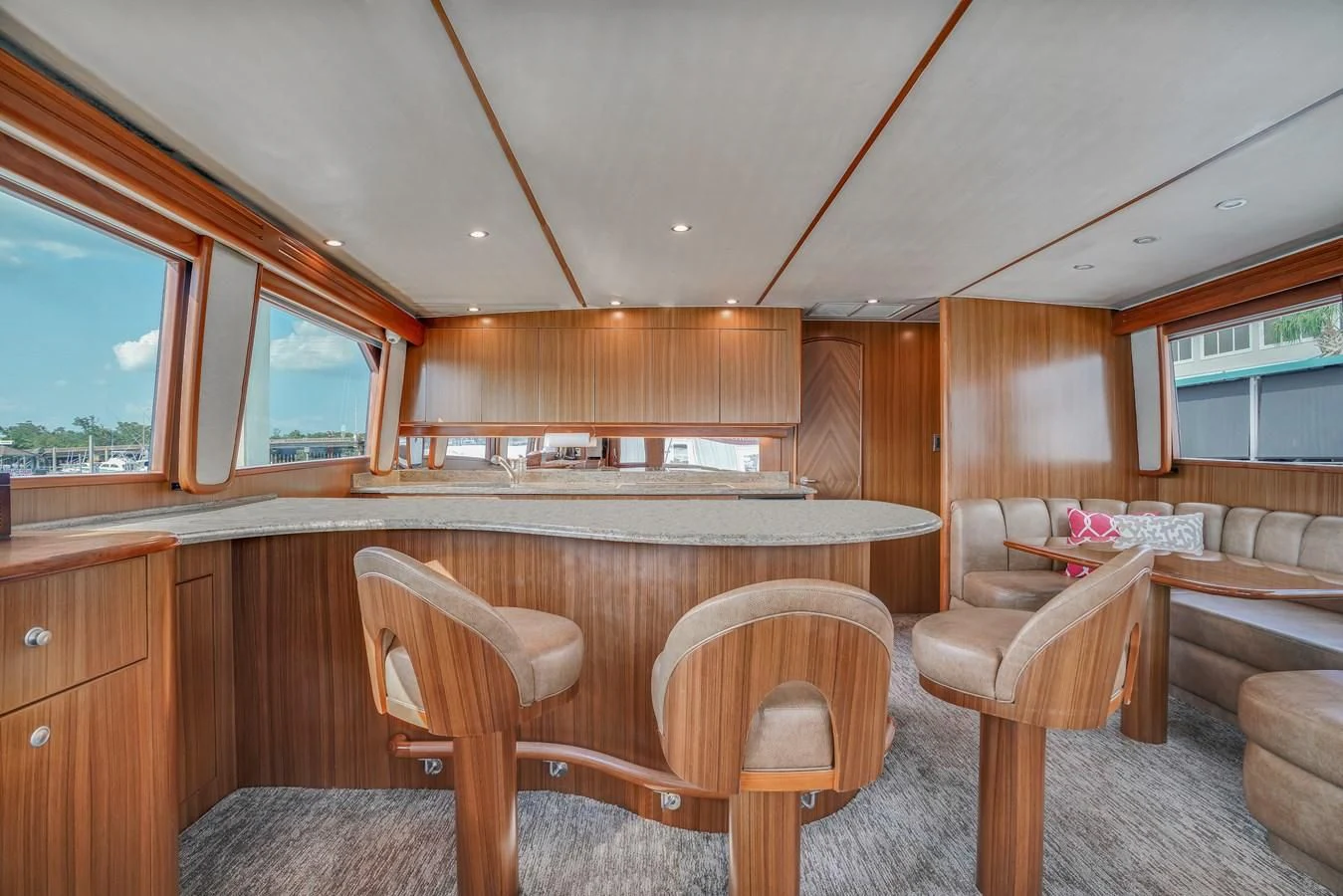 a large kitchen with wooden cabinets aboard RHINO FISH Yacht for Sale