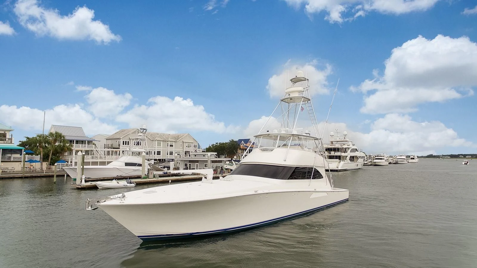 a boat docked at a pier aboard RHINO FISH Yacht for Sale