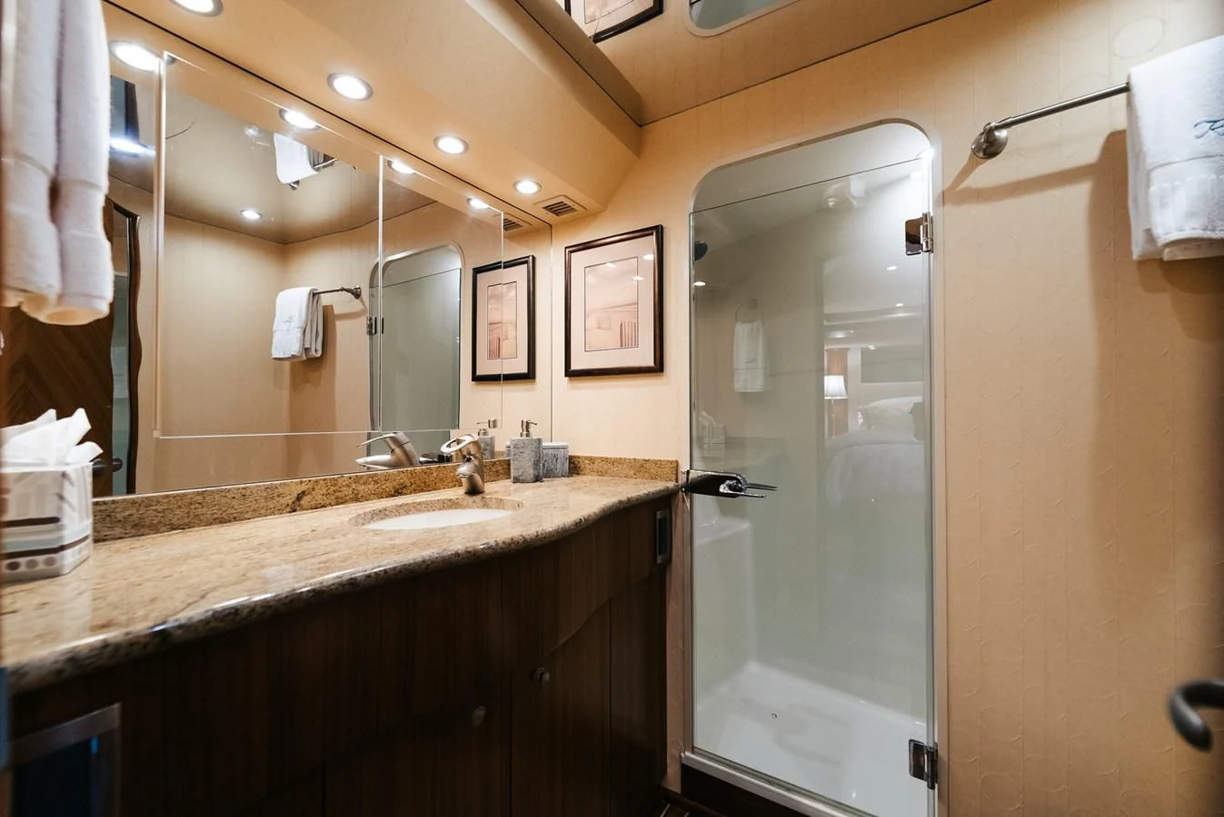 a bathroom with a large mirror aboard RHINO FISH Yacht for Sale