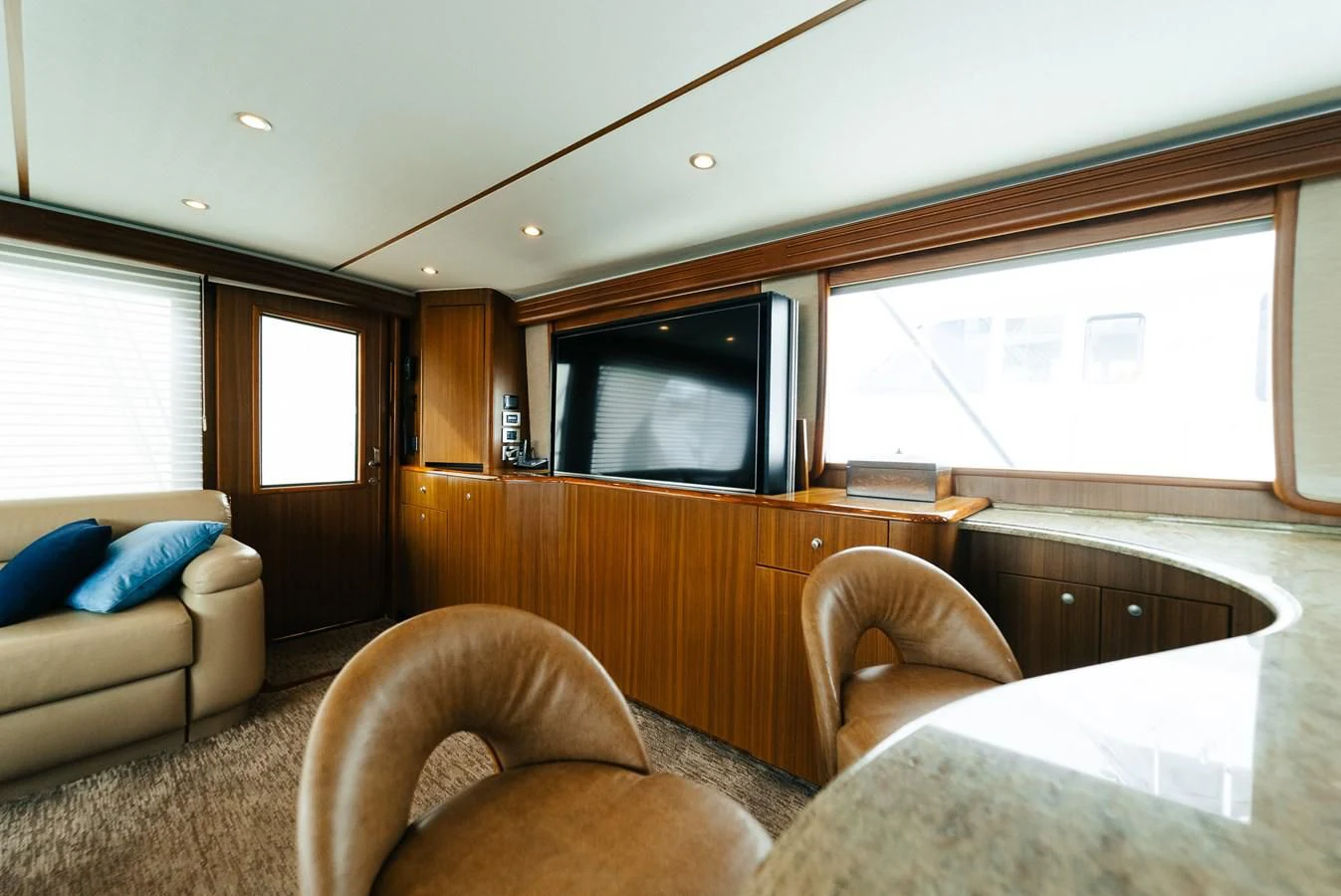 a living room with a couch and a television aboard RHINO FISH Yacht for Sale