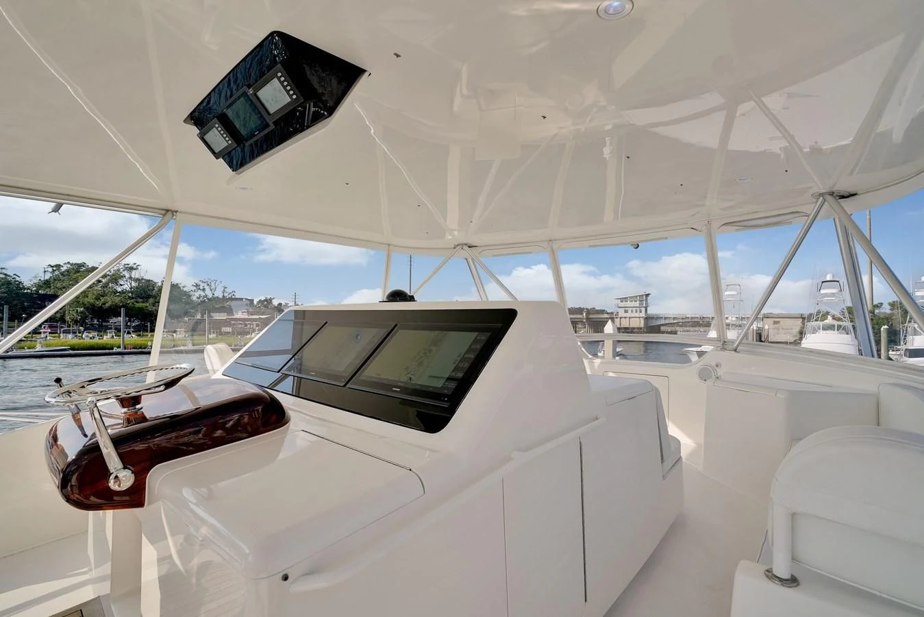 a white tent with a black screen and a black tablet on the front aboard RHINO FISH Yacht for Sale
