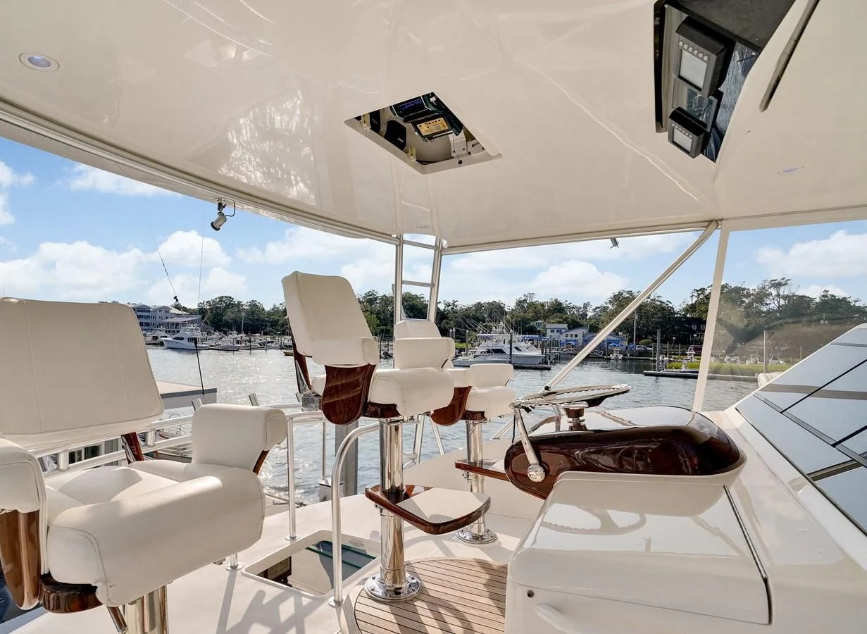 a boat with chairs and tables aboard RHINO FISH Yacht for Sale