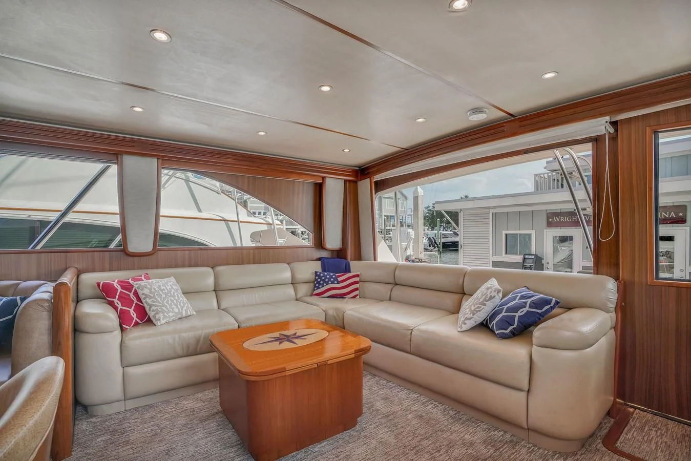a living room with a couch and a table aboard RHINO FISH Yacht for Sale