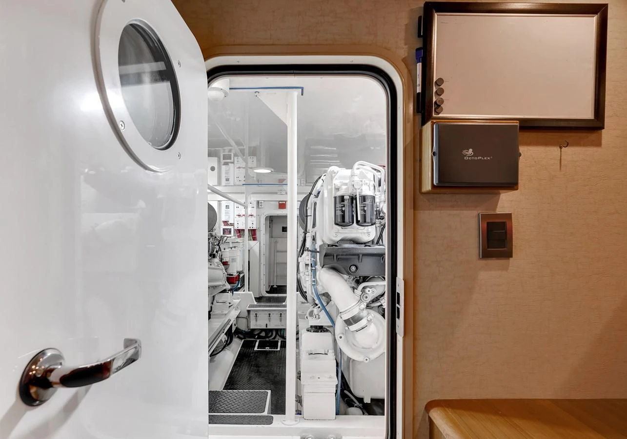 a room with a machine and doors aboard RHINO FISH Yacht for Sale