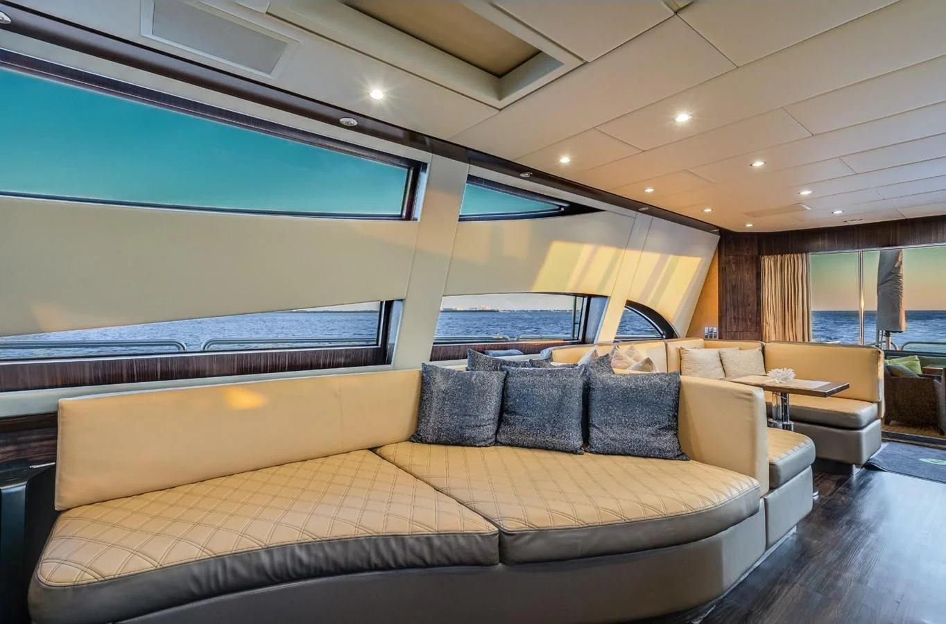 a large living room with a large bed and a large window aboard ENCORE Yacht for Sale