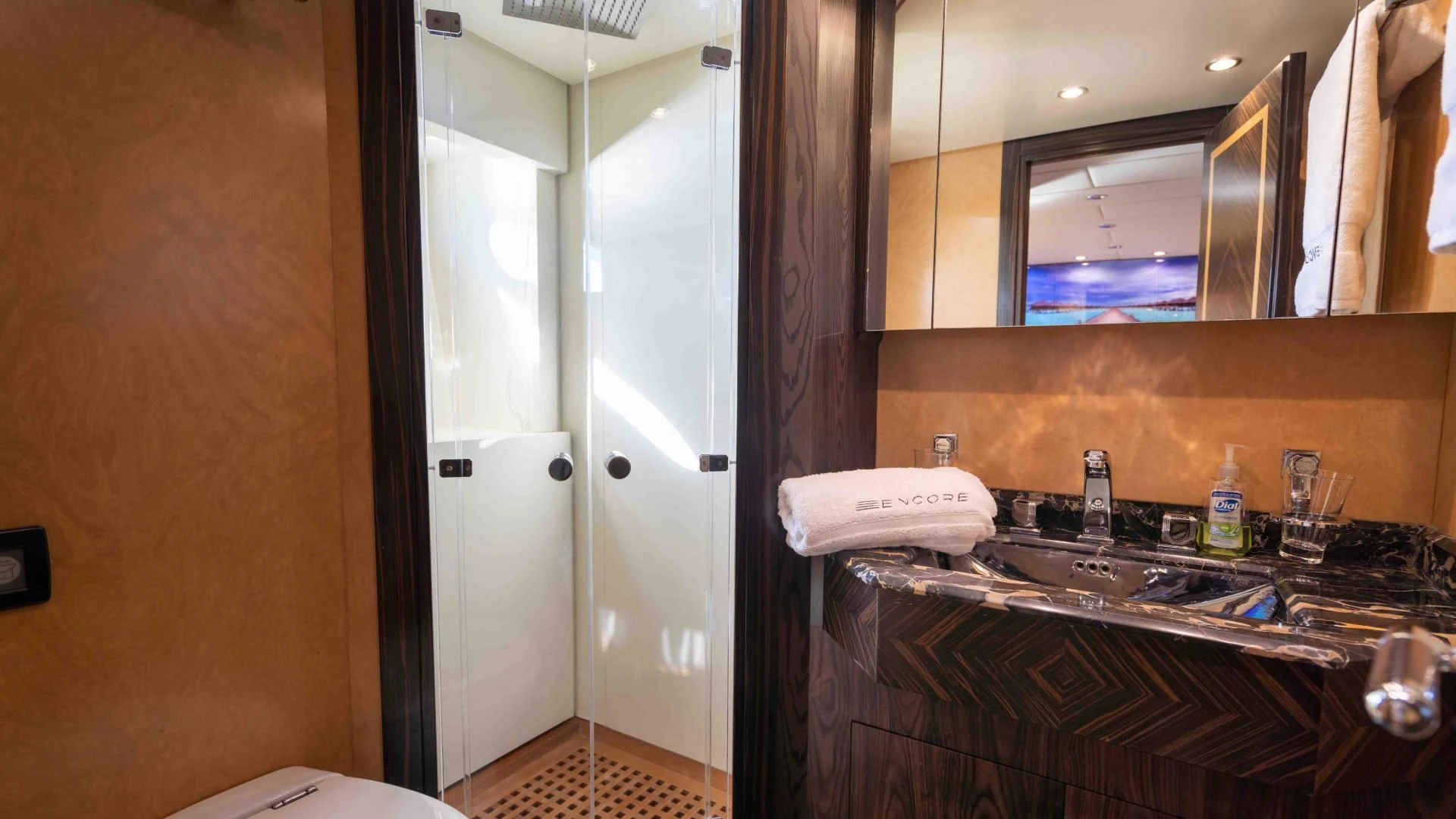 a bathroom with a sink and a mirror aboard ENCORE Yacht for Sale