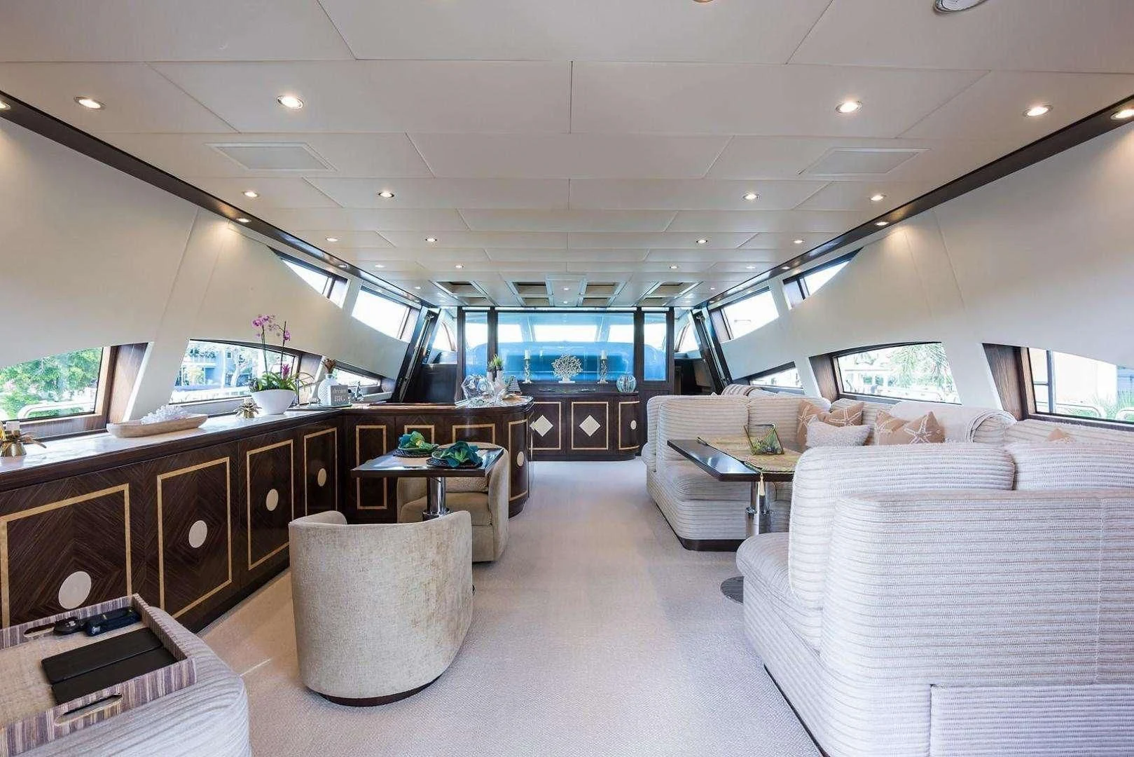 a room with a couch and a table aboard ENCORE Yacht for Sale