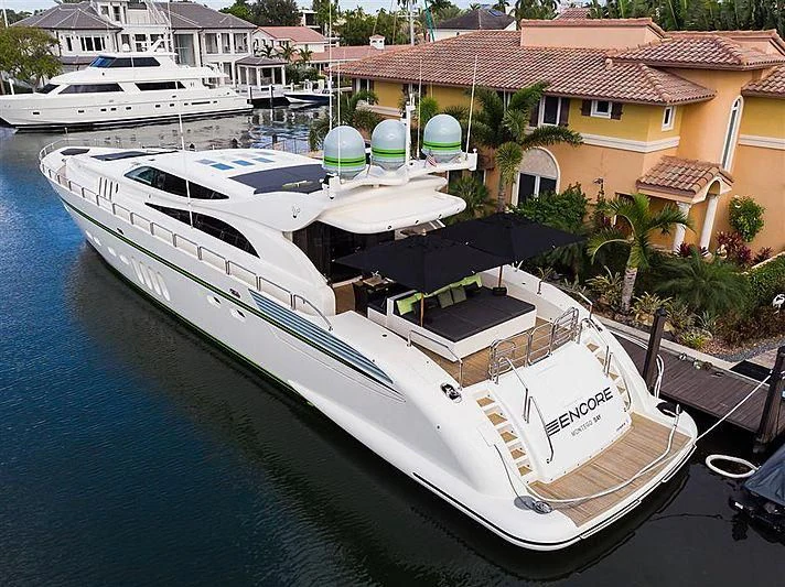 a boat docked in a harbor aboard ENCORE Yacht for Sale