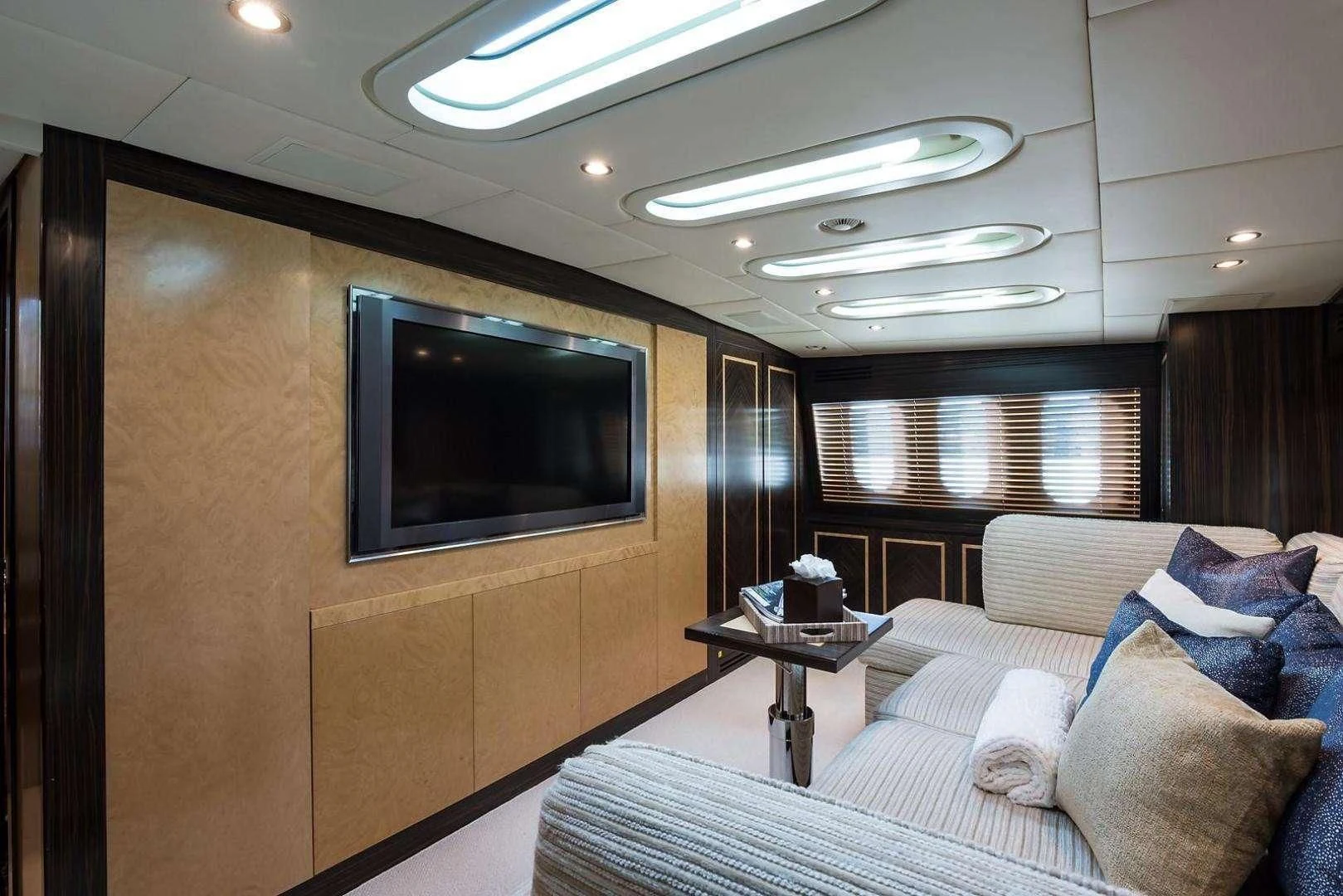 a living room with a tv aboard ENCORE Yacht for Sale