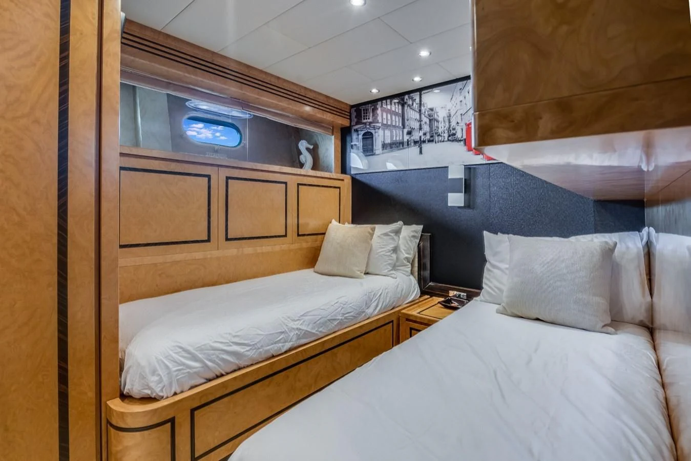 a room with two beds aboard ENCORE Yacht for Sale