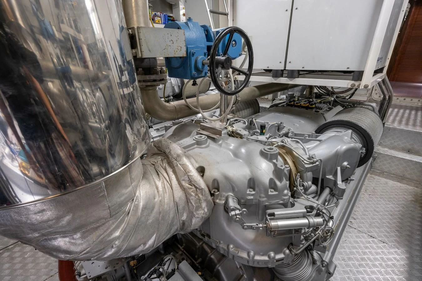 a car engine with a large metal cylinder aboard ENCORE Yacht for Sale