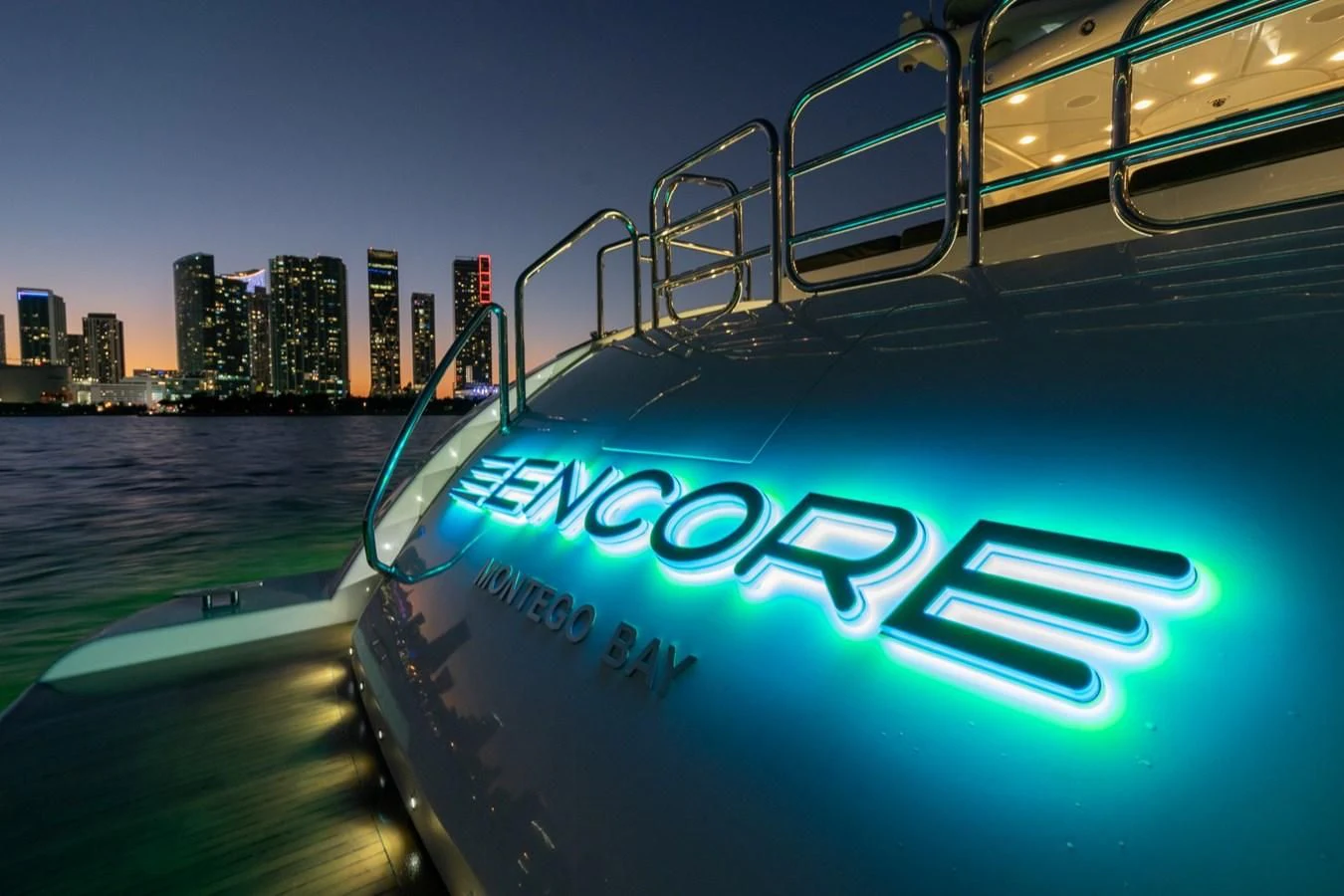 a boat with a city in the background aboard ENCORE Yacht for Sale