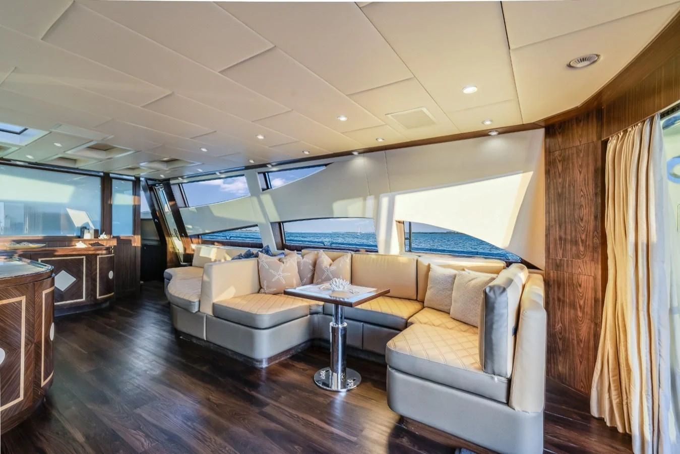 a living room with a couch and a table aboard ENCORE Yacht for Sale