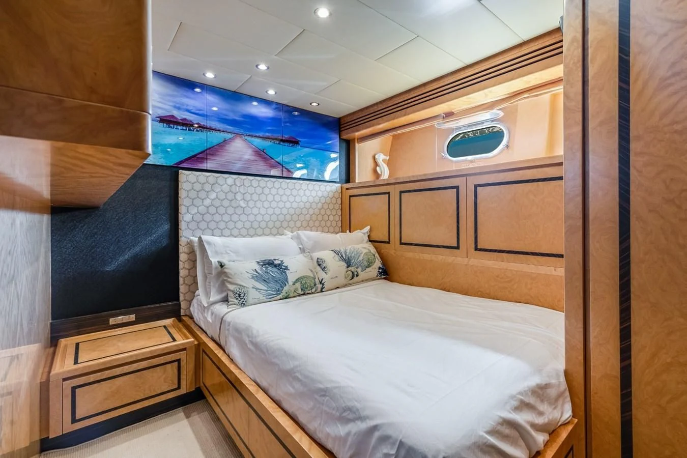 a room with a bed and a tv aboard ENCORE Yacht for Sale