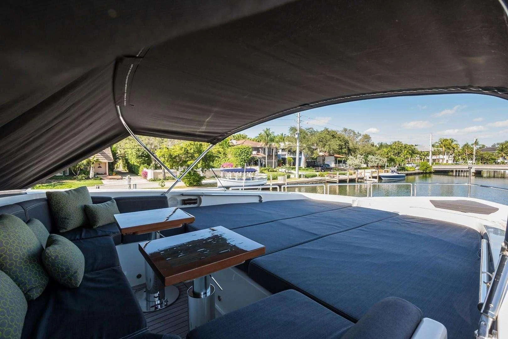 a large patio with a pool and a view of the water aboard ENCORE Yacht for Sale