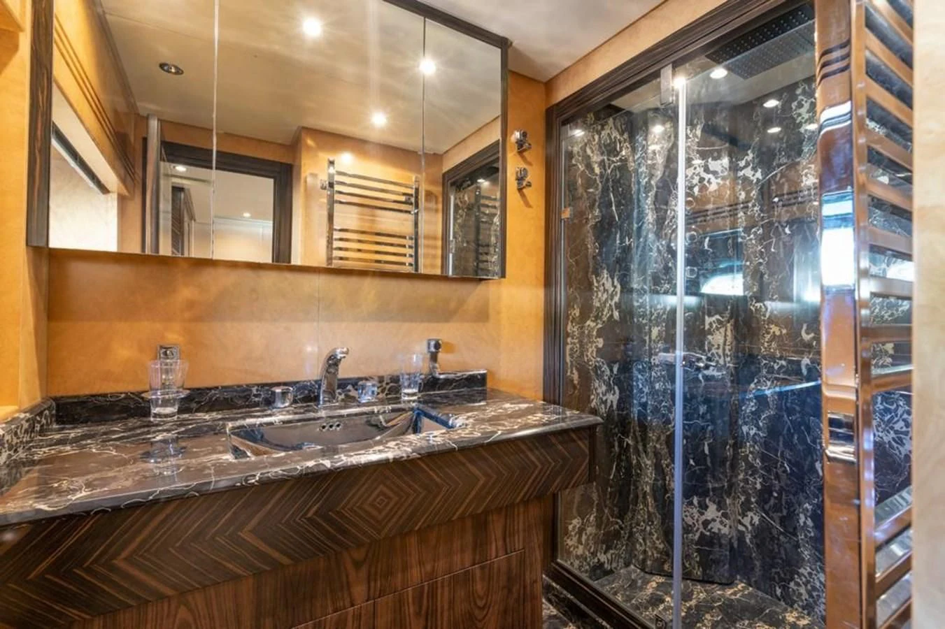 a bathroom with a glass shower aboard ENCORE Yacht for Sale