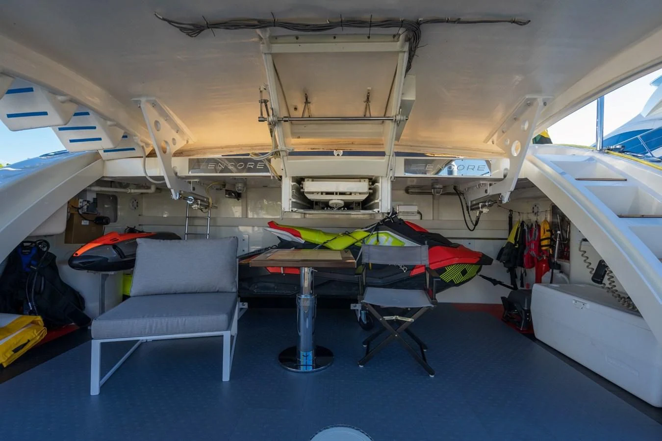 a boat with a chair and a bench in it aboard ENCORE Yacht for Sale