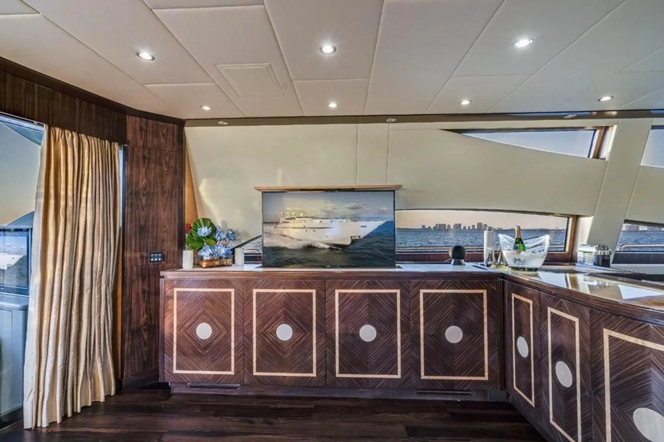 a large kitchen with a large television aboard ENCORE Yacht for Sale
