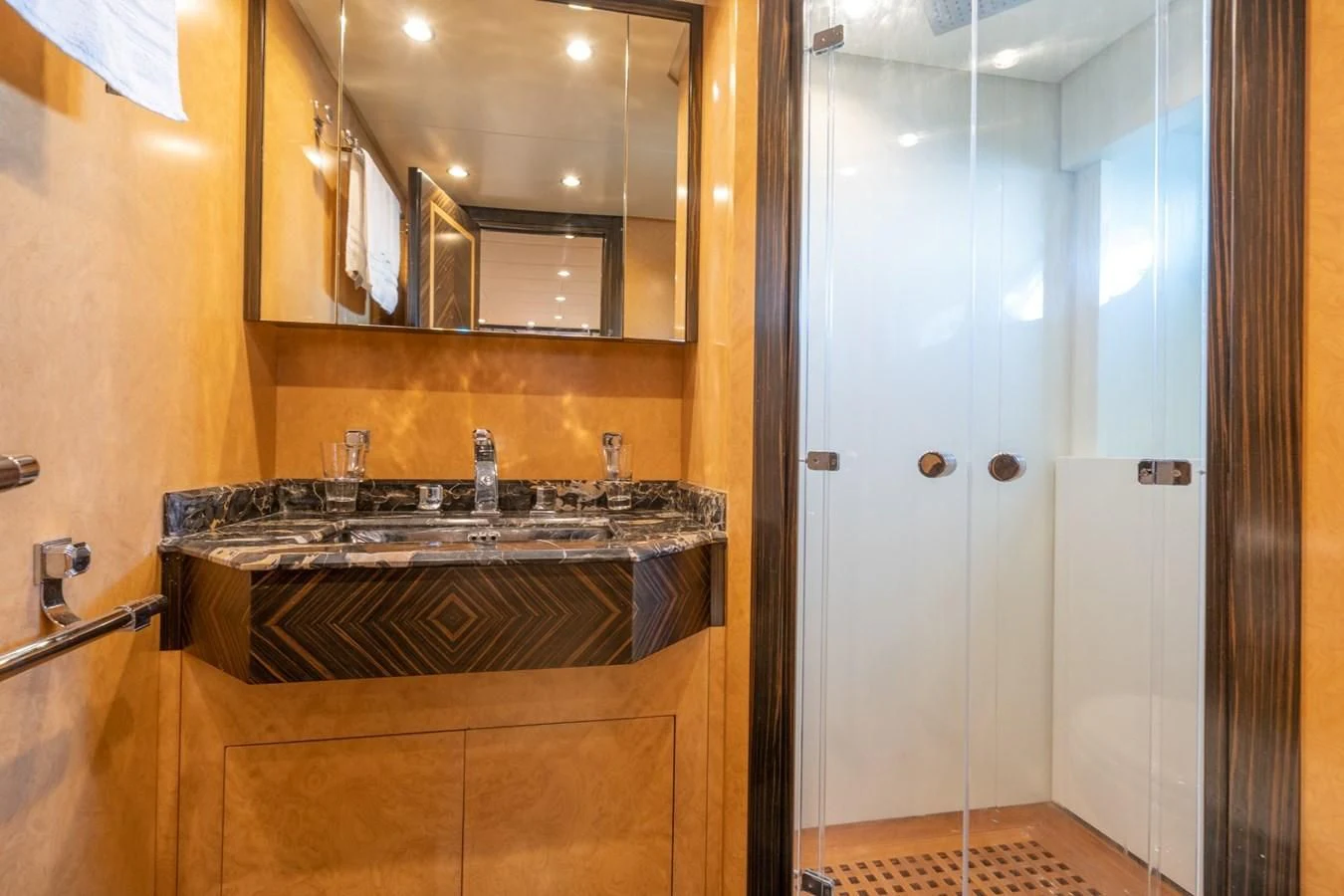 a bathroom with a sink and a mirror aboard ENCORE Yacht for Sale