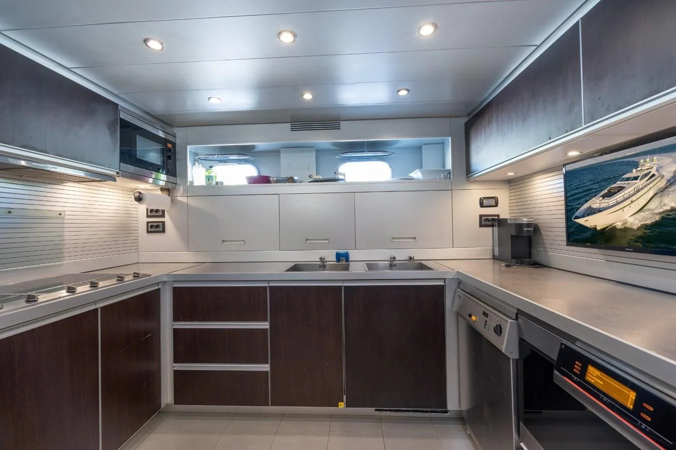a kitchen with a large island aboard ENCORE Yacht for Sale