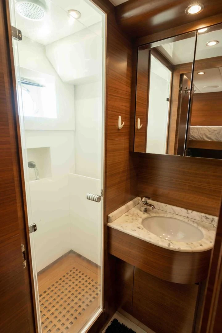 a bathroom with a sink and a mirror aboard ENCORE Yacht for Sale