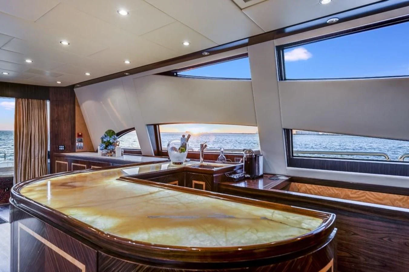 a large kitchen with a large island aboard ENCORE Yacht for Sale