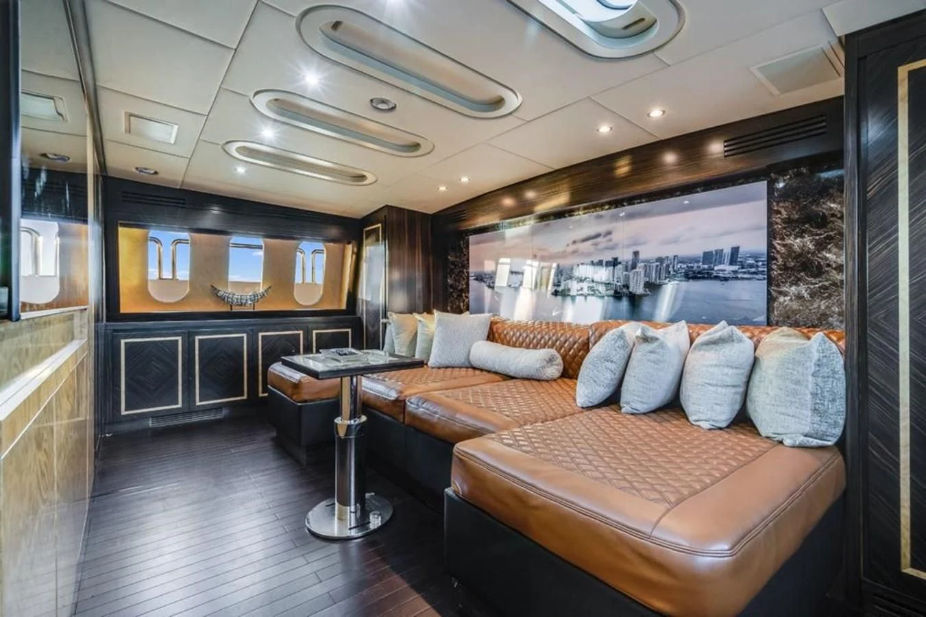 a living room with a couch and a table aboard ENCORE Yacht for Sale