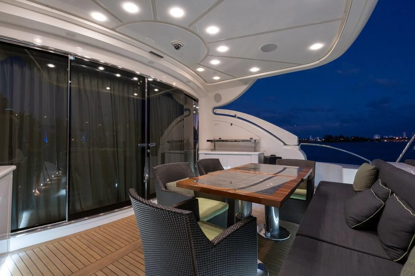 a room with a table and chairs aboard ENCORE Yacht for Sale