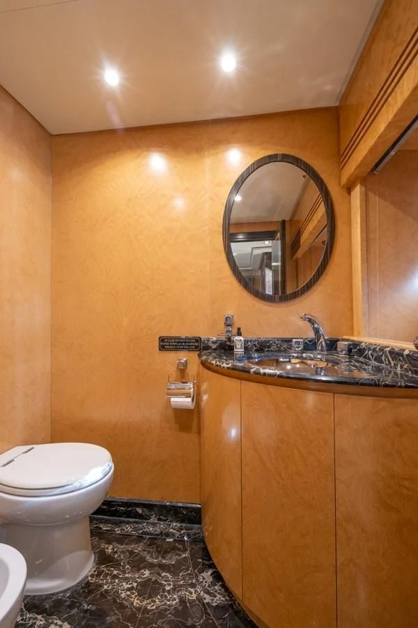 a bathroom with a sink and a toilet aboard ENCORE Yacht for Sale