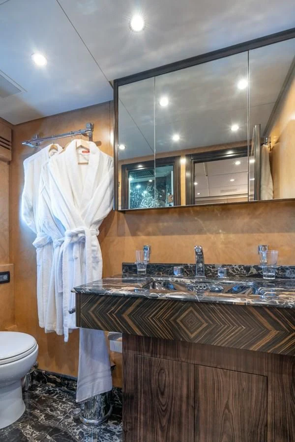 a bathroom with a sink and a mirror aboard ENCORE Yacht for Sale