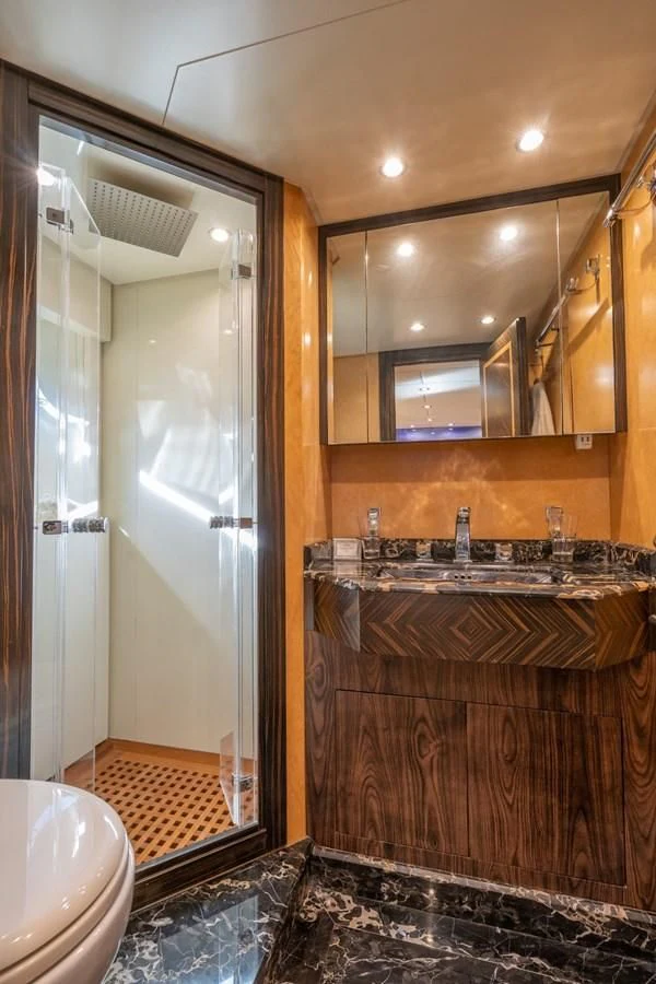 a bathroom with a glass shower aboard ENCORE Yacht for Sale