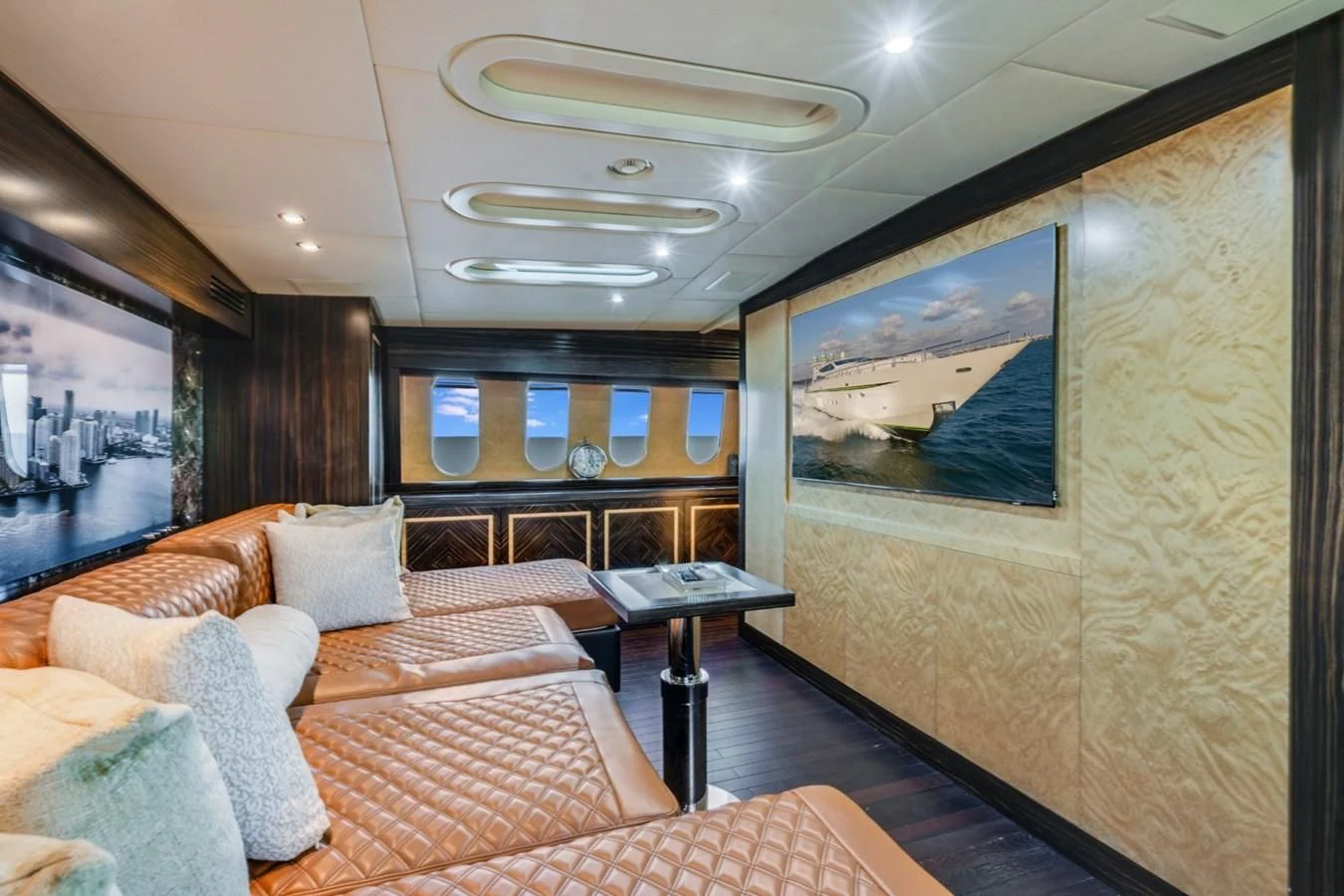 a living room with a couch and a table aboard ENCORE Yacht for Sale