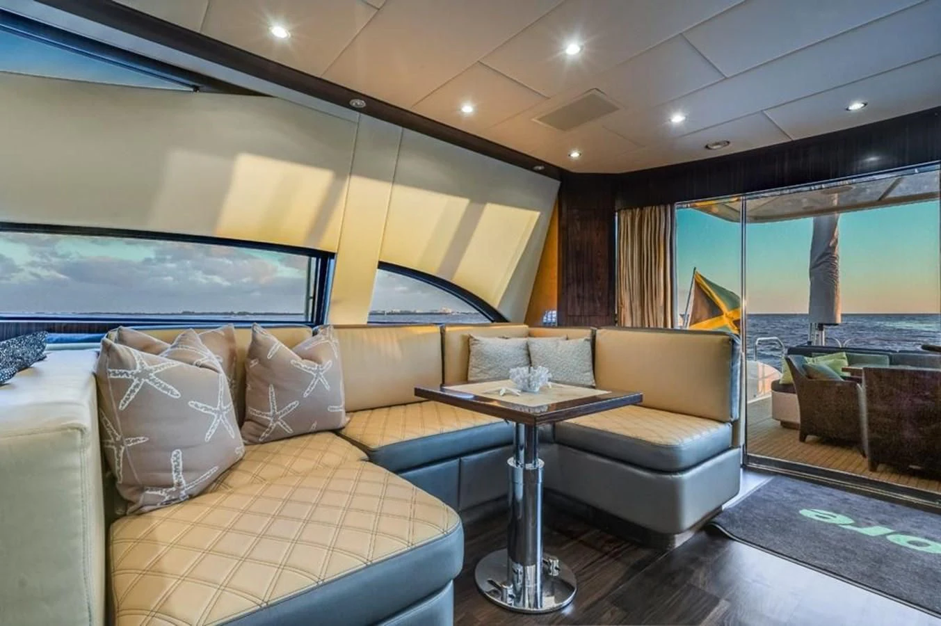 a living room with a couch and a table aboard ENCORE Yacht for Sale