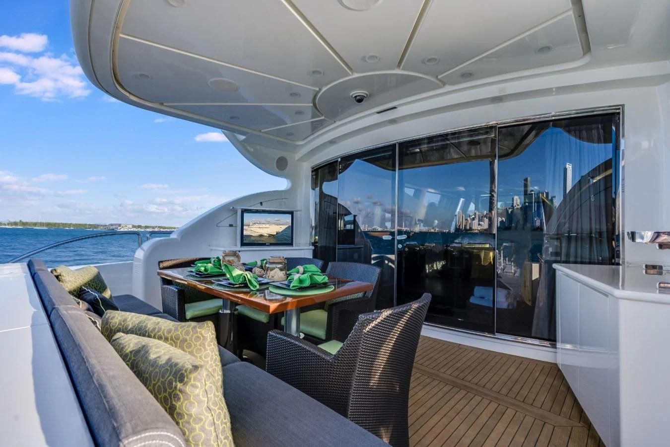 a boat with a table and chairs aboard ENCORE Yacht for Sale