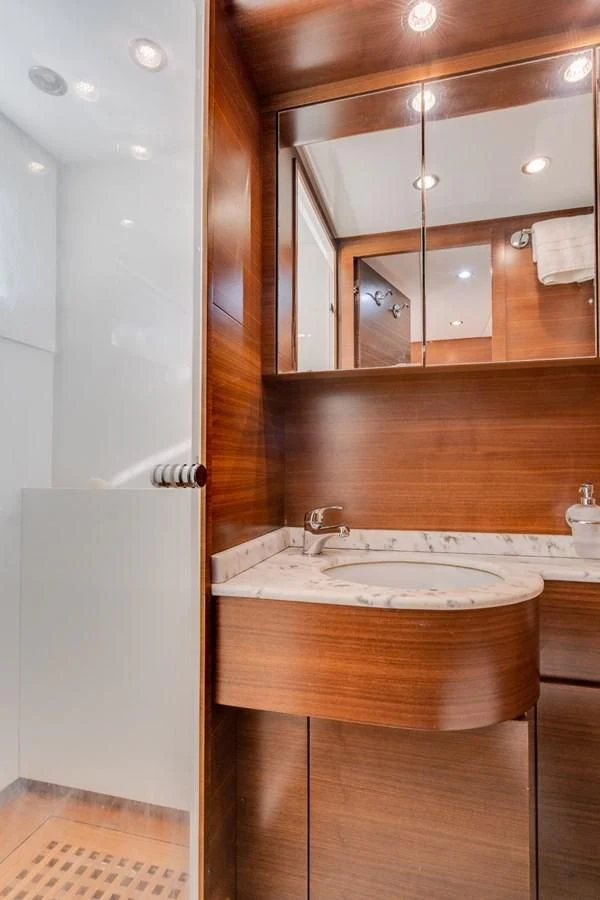 a bathroom with a sink and a mirror aboard ENCORE Yacht for Sale