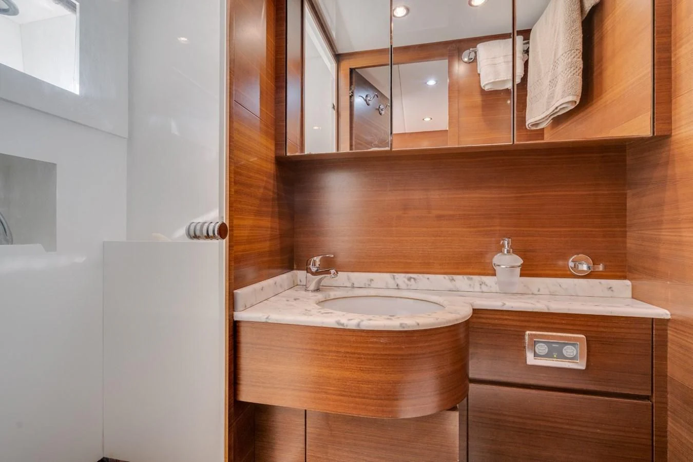 a bathroom with a sink and a mirror aboard ENCORE Yacht for Sale