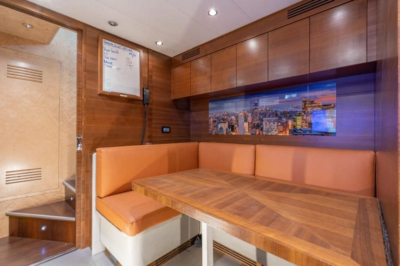 a room with a table and chairs aboard ENCORE Yacht for Sale