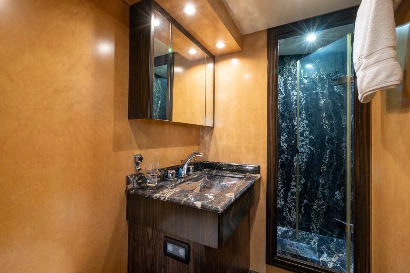 a bathroom with a large mirror aboard ENCORE Yacht for Sale