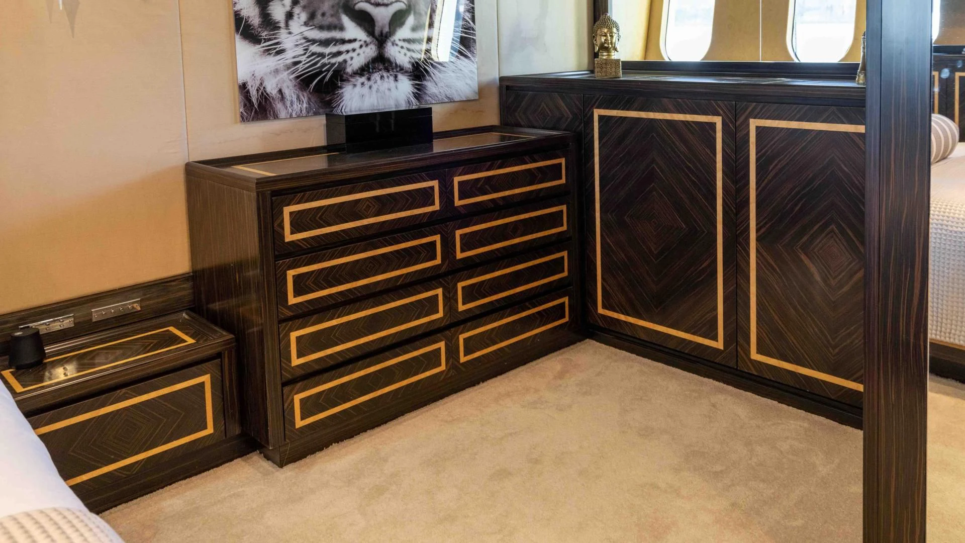 a room with a cabinet and a television aboard ENCORE Yacht for Sale