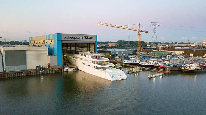 a large ship docked at a port aboard BLISS Yacht for Sale