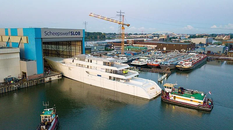 a port with boats and cranes aboard BLISS Yacht for Sale