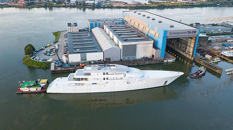 a large ship docked at a port aboard BLISS Yacht for Sale